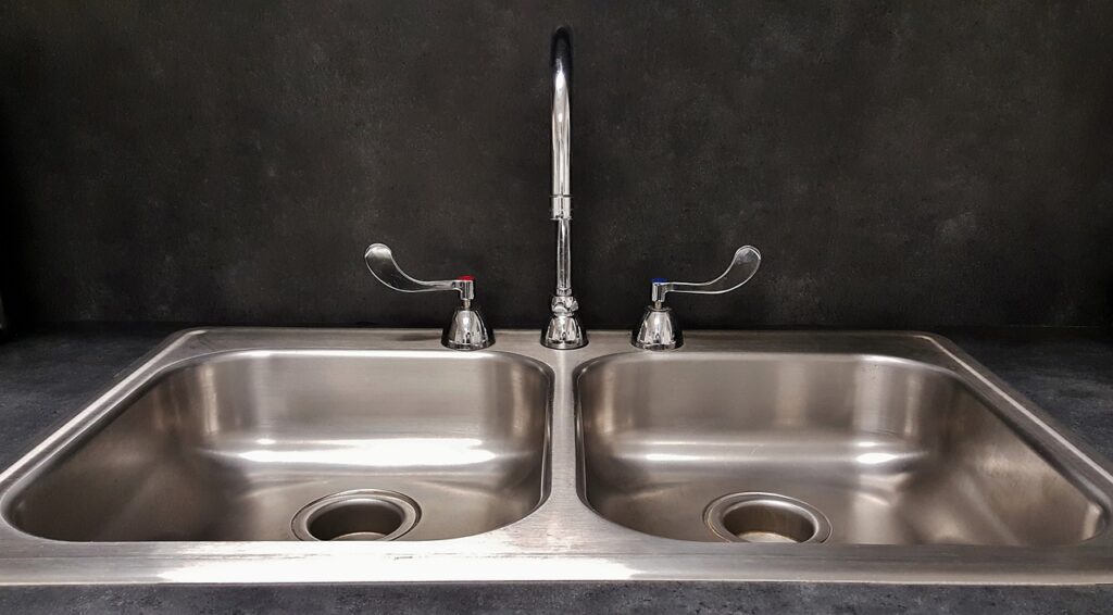 A Cleaned, Polished, and Shiny Metal Chrome Kitchen Sink 